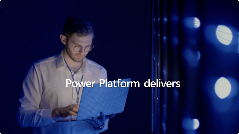 A man holding a laptop with the text Power Platform delivers.