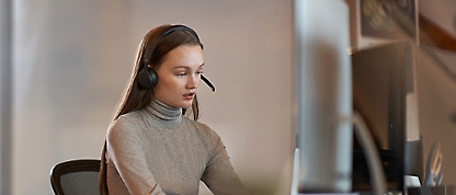 A woman wearing a headset.