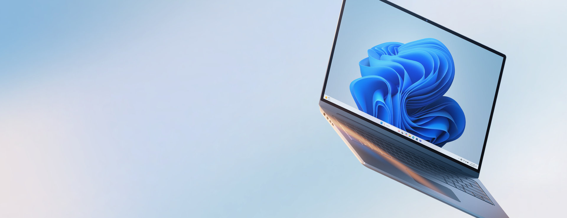 An open Microsoft Windows laptop with the blue bloom screen