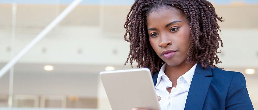 A business woman using a tablet computer.