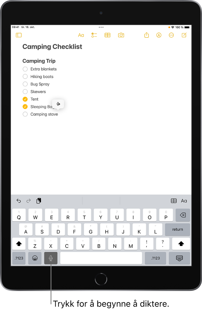 Skjermtastaturet som viser Dikter-tasten (til venstre for mellomromstasten), som du kan trykke på for å diktere tekst.