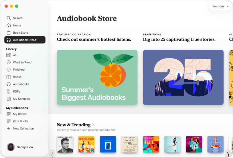 Một cửa sổ ứng dụng Sách đang hiển thị Audiobook Store được chọn trong thanh bên, với các danh mục cho tiêu đề ở bên phải, bao gồm Mới & Đang thịnh hành.