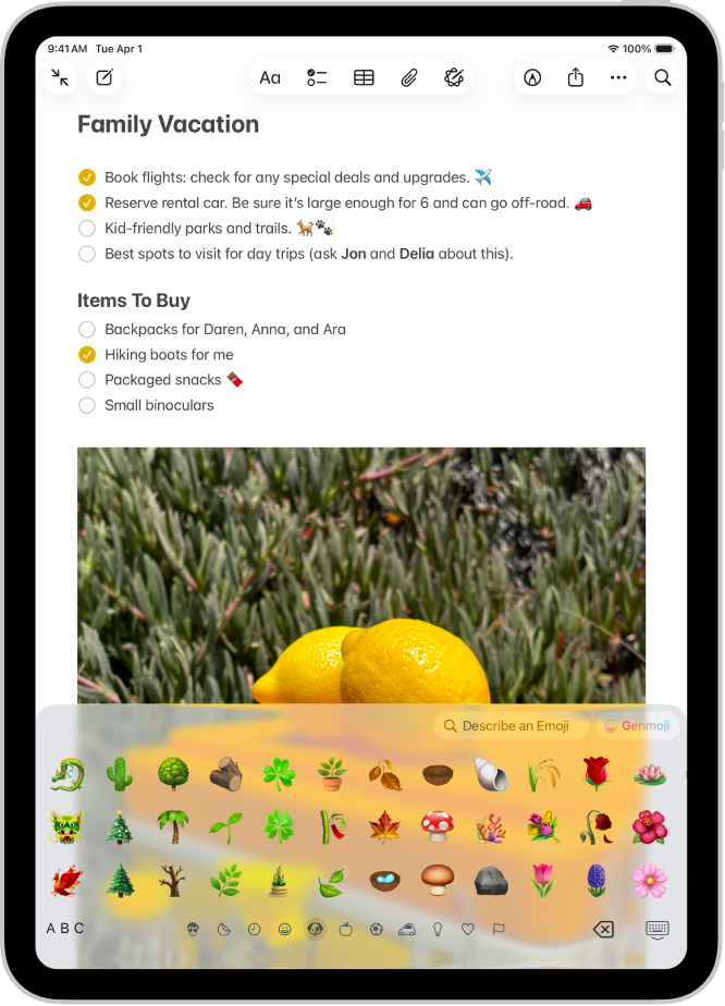 Boven in het scherm is een notitie geopend in de Notities-app. Onder in het scherm is het emoji-toetsenbord geopend.