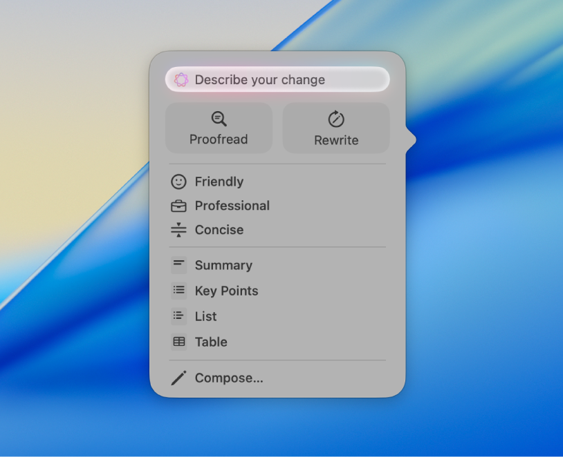 The Writing Tools dialogue on the Mac wallpaper. The dialogue has a “Describe your change” field at the top, followed by Proofread and Rewrite buttons. You can choose a Friendly, Professional,or Concise tone below that, and at the bottom are Summary, Key Points, Table and List buttons.