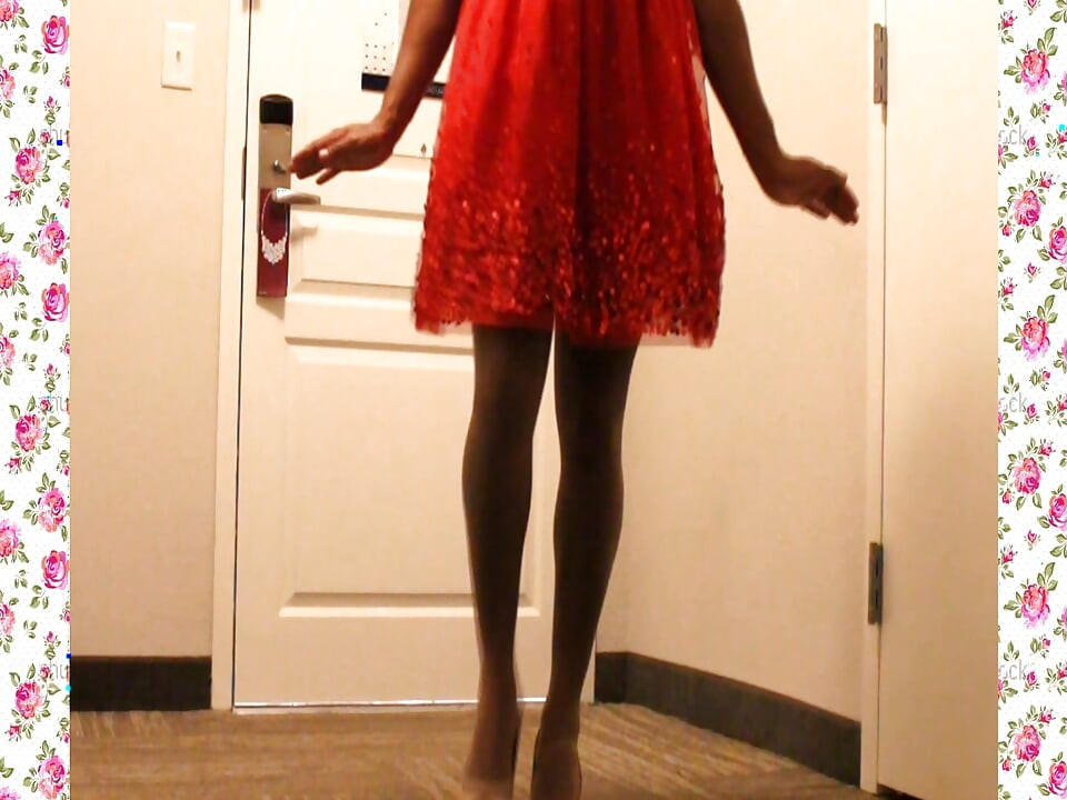 A 1950's SISSY DANCE FOR HER HUSBAND WEARING A PARTY DRESS