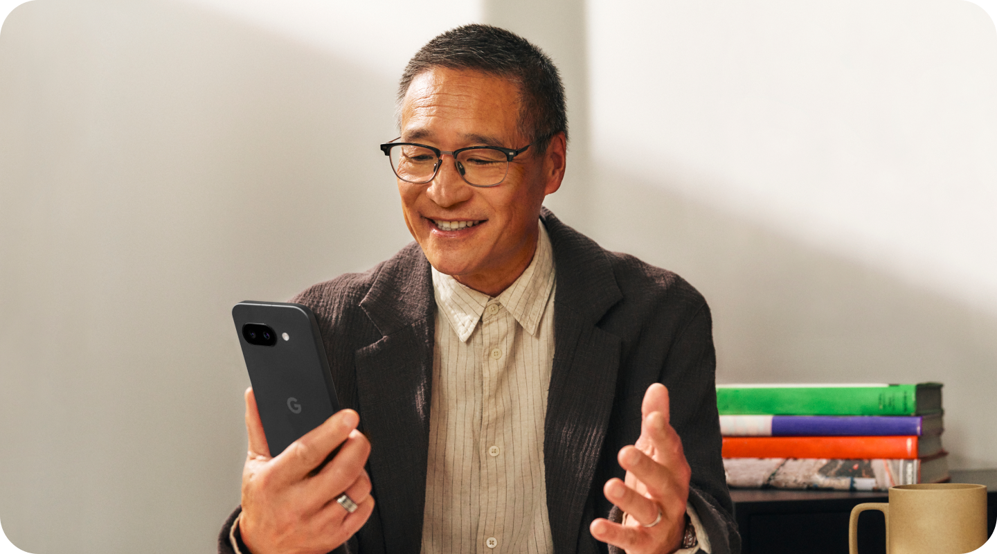 A small business owner works on his Google Pixel 9a phone.