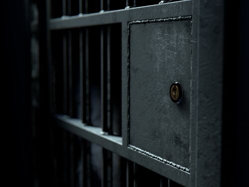 A closeup of the locking mechanism of a closed jail cell with welded iron bars on a dimly lit dark background - 3D render