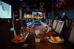 Warmly lit interior with cocktails and appetizers at Jade Eatery & Lounge in Hicksville, Long Island