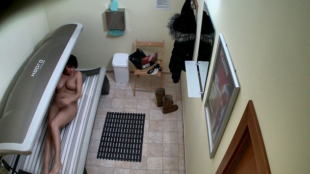 Mysterious Lady Strips in Solarium